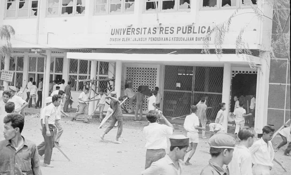 A mob attacks the Res Publica University in Jakarta, Indonesia, 12 October 1965. Photograph: Bettmann